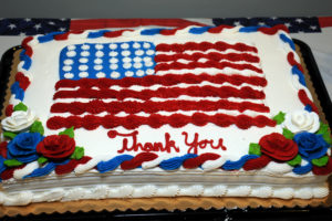Cake decorated with a flag for Veterans Day celebration at Allerton House in Hingham