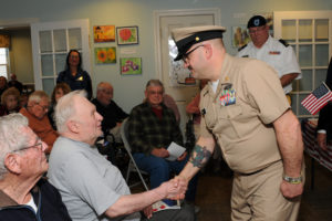 Navy Petty Officer thanks an Air Force veteran who lives at Allerton Houses in Hingham