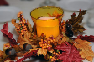 Lit candle holiday centerpiece