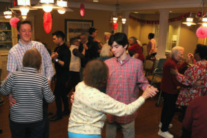 Allerton House in Hingham residents dance with high school students at the Valentine's Ballroom Dancing celebration