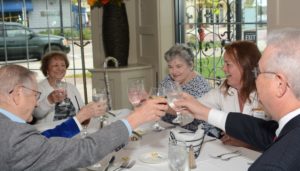 Allerton House in Hingham Resident Council members raise their glasses in a toast