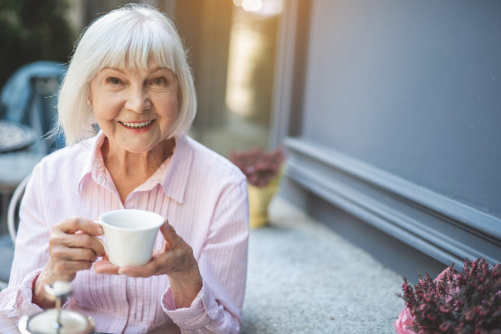 senior woman enjoying a cup of coffee