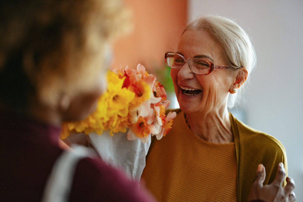 Senior woman getting flowers