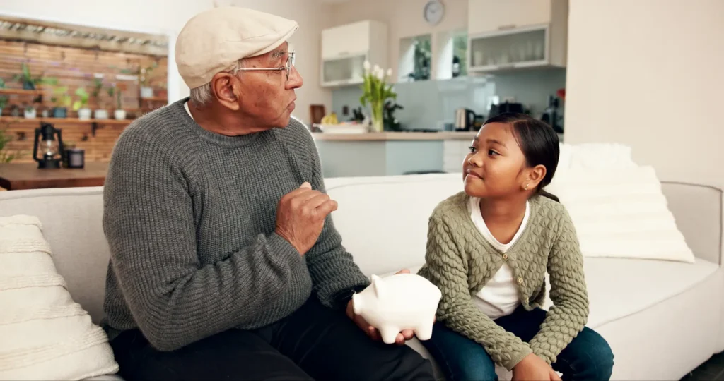 Grandfather imparts financial wisdom upon granddaughter
