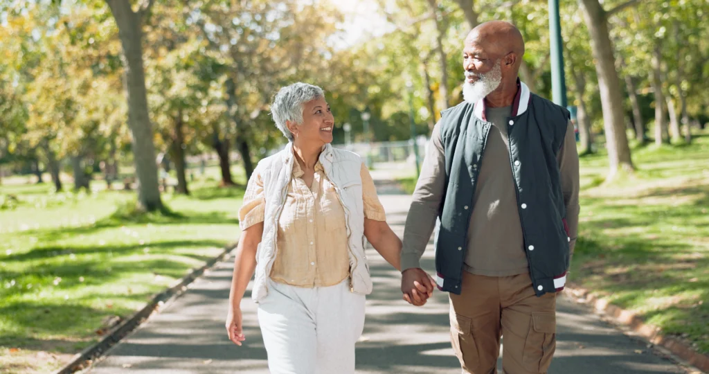 Seniors walking while wearing the best walking shoes for seniors. 